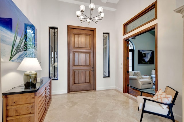 foyer featuring an inviting chandelier and plenty of natural light