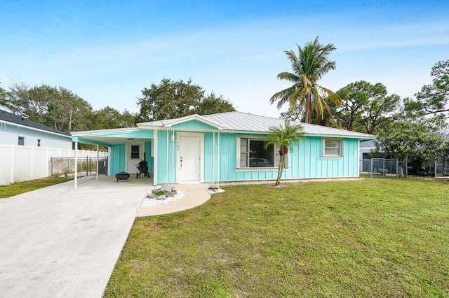 single story home with a carport and a front lawn