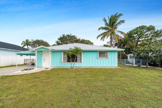 ranch-style house with a front lawn and a carport