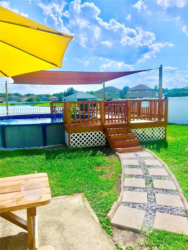 exterior space with a water view and a lawn