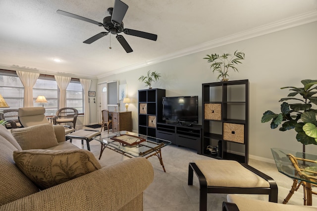 living area with a ceiling fan, light tile patterned flooring, crown molding, and baseboards