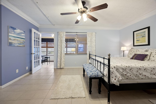 bedroom featuring french doors, a textured ceiling, light tile patterned floors, ornamental molding, and ceiling fan