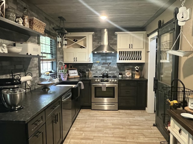 kitchen featuring open shelves, white cabinets, stainless steel range with electric cooktop, wall chimney range hood, and dishwasher