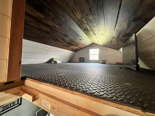 bonus room with wood ceiling, wooden walls, and vaulted ceiling