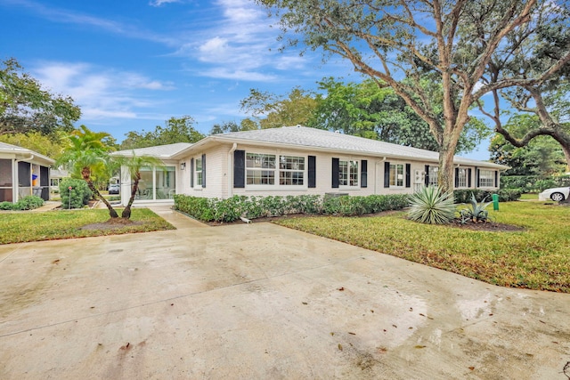 ranch-style house with a front yard