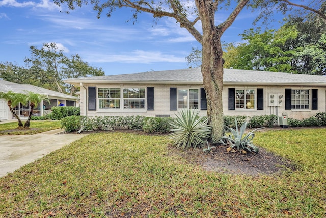 ranch-style house with a front yard