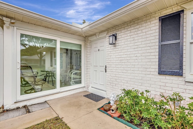 property entrance with a patio area