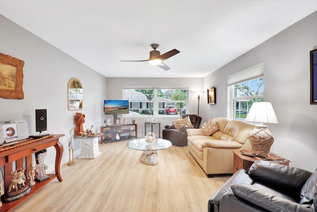 living room featuring ceiling fan and light wood-type flooring