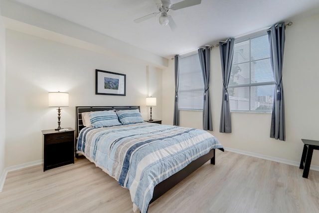 bedroom featuring light hardwood / wood-style floors and ceiling fan