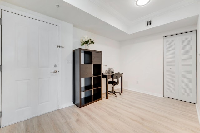 home office featuring light hardwood / wood-style flooring and ornamental molding