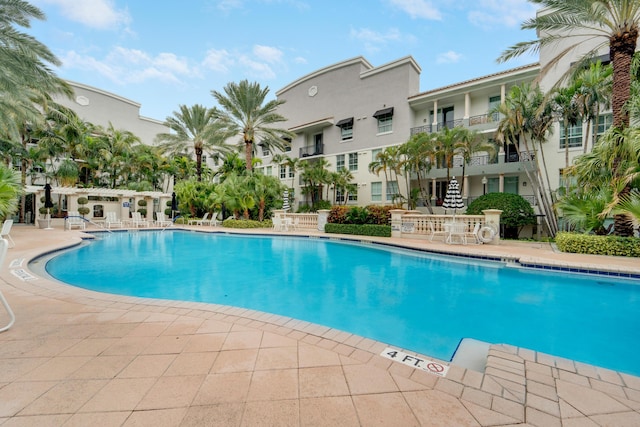 view of pool featuring a pergola and a patio area