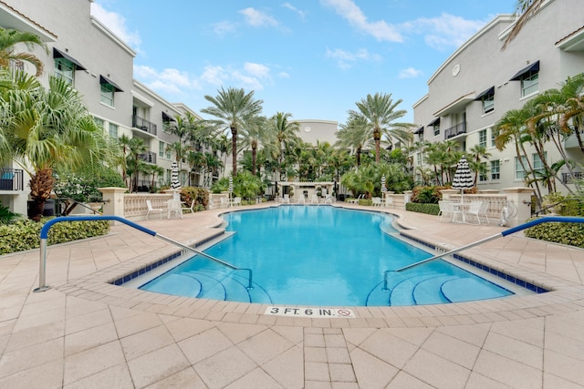 view of swimming pool featuring a patio