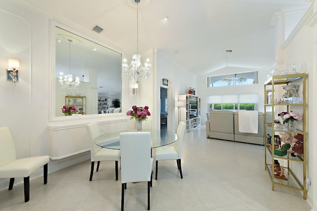 dining area featuring ornamental molding, vaulted ceiling, and a notable chandelier