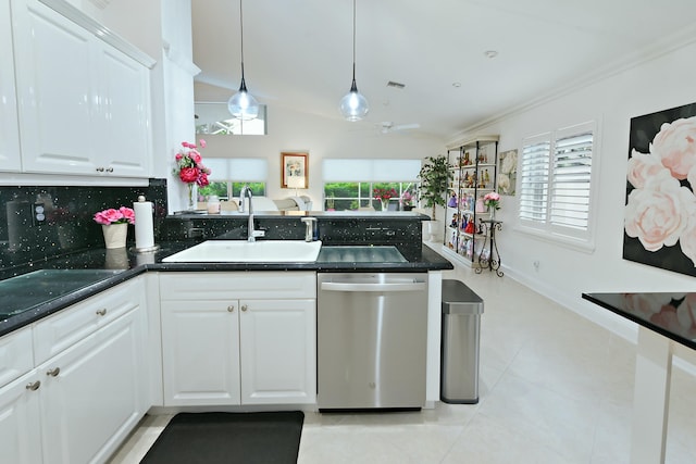 kitchen featuring decorative light fixtures, tasteful backsplash, dishwasher, sink, and white cabinets