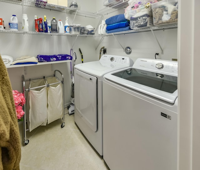 clothes washing area with independent washer and dryer