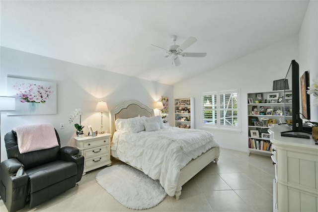 bedroom with ceiling fan, lofted ceiling, and light tile patterned floors