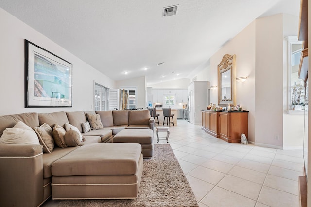 tiled living room with vaulted ceiling