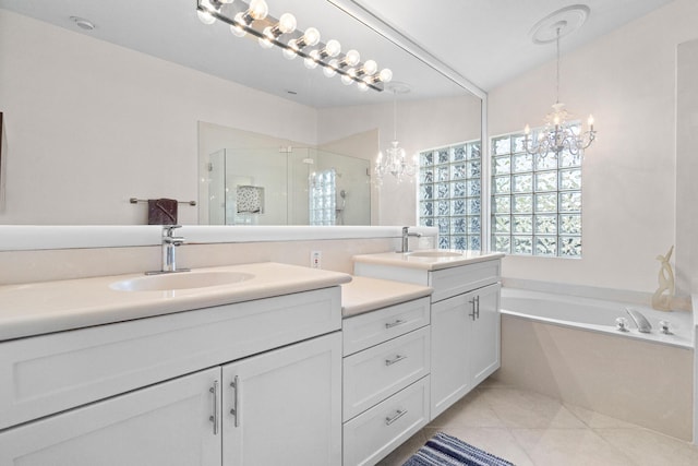 bathroom with vanity, tile patterned flooring, a notable chandelier, and plus walk in shower