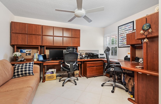 office space with a textured ceiling and ceiling fan