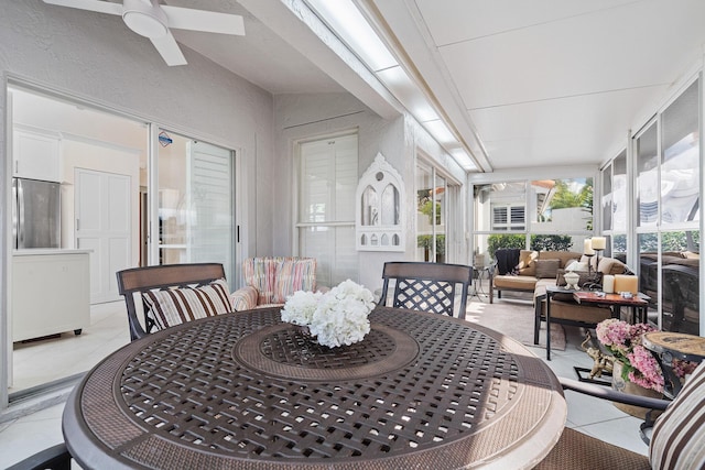 dining area featuring ceiling fan and light tile patterned flooring