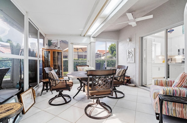 sunroom featuring ceiling fan