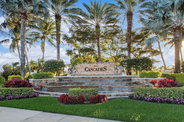 community / neighborhood sign featuring a lawn