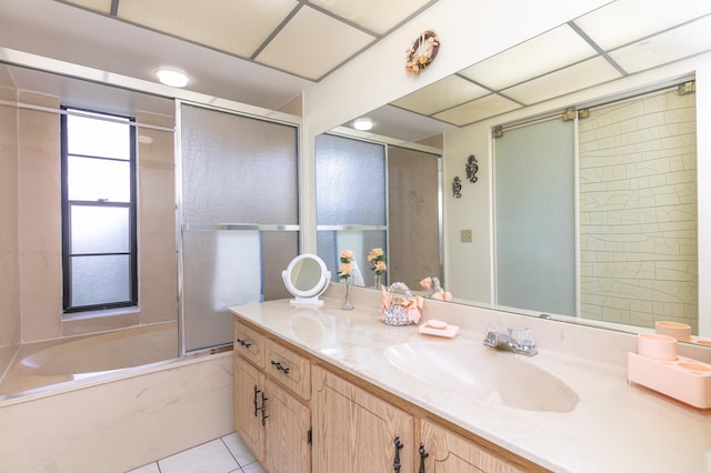 bathroom with tile patterned flooring, vanity, and shower / bath combination with glass door