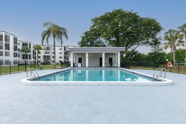 view of swimming pool featuring a patio area