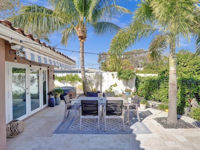 view of patio featuring french doors