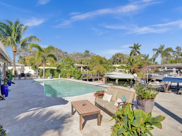 view of swimming pool with a patio