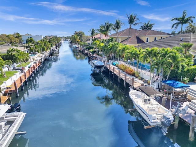 exterior space featuring a boat dock and a water view