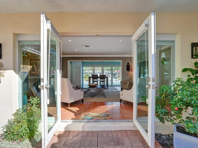 view of exterior entry featuring french doors