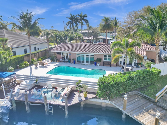 view of pool featuring a patio and french doors