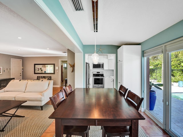 dining space with light tile patterned flooring