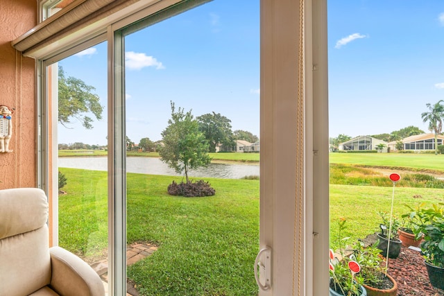 entryway featuring a water view and a healthy amount of sunlight