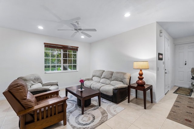 living room with ceiling fan and light tile patterned flooring