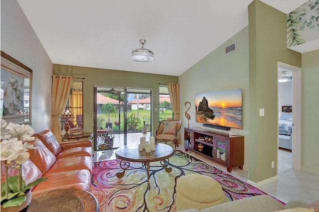 living room featuring light tile patterned floors and lofted ceiling