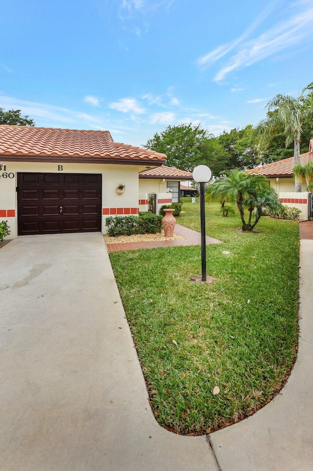 view of front of home with a garage and a front yard