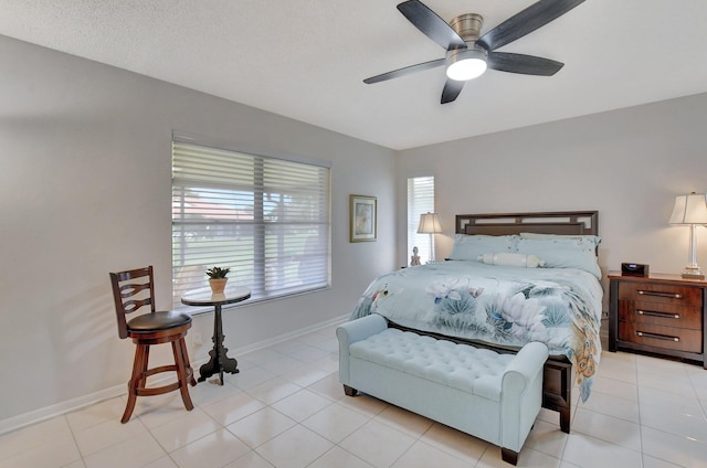 bedroom with light tile patterned floors and ceiling fan