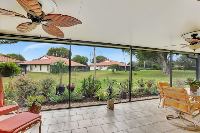 sunroom / solarium with ceiling fan