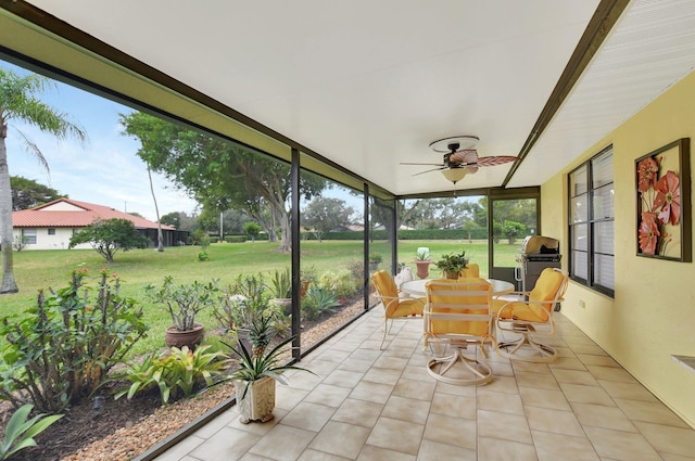 sunroom with ceiling fan and a healthy amount of sunlight