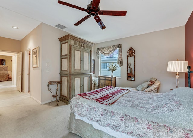 carpeted bedroom with ceiling fan