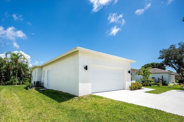 view of property exterior featuring a garage, a yard, and central AC