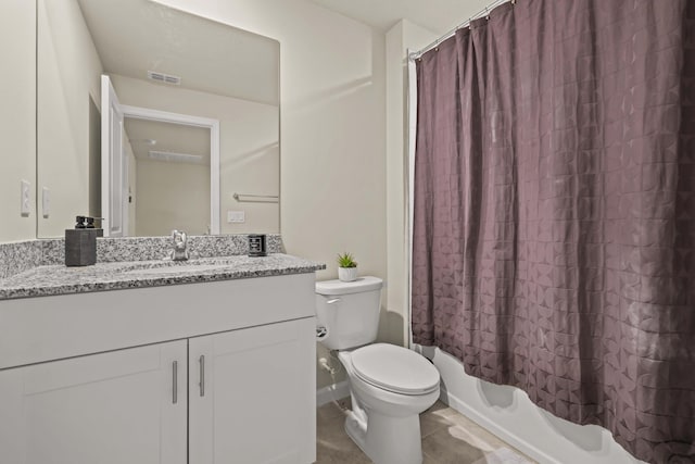 full bathroom with shower / bath combo with shower curtain, toilet, and vanity