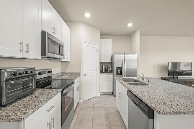 kitchen featuring sink, a kitchen island with sink, white cabinetry, and stainless steel appliances