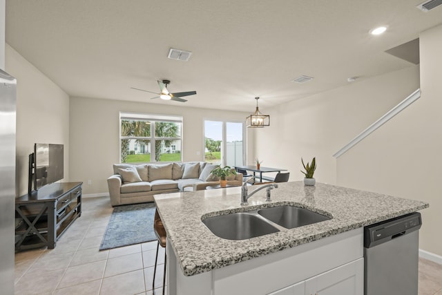 kitchen featuring sink, white cabinetry, dishwasher, and light stone countertops