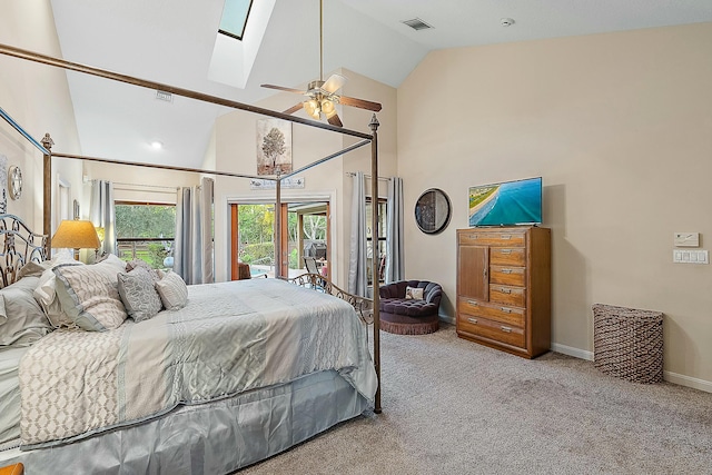 bedroom with carpet flooring, a skylight, access to exterior, high vaulted ceiling, and ceiling fan