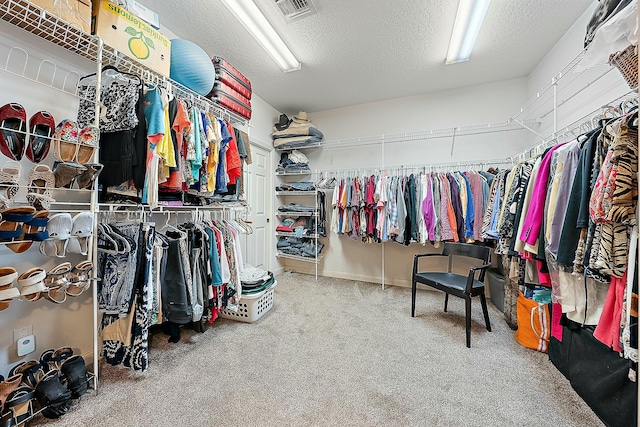 spacious closet with visible vents and carpet