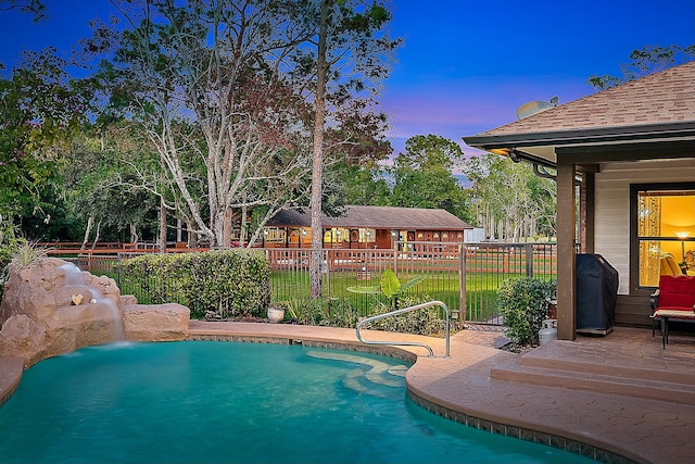 view of swimming pool featuring a fenced in pool, fence, and a deck