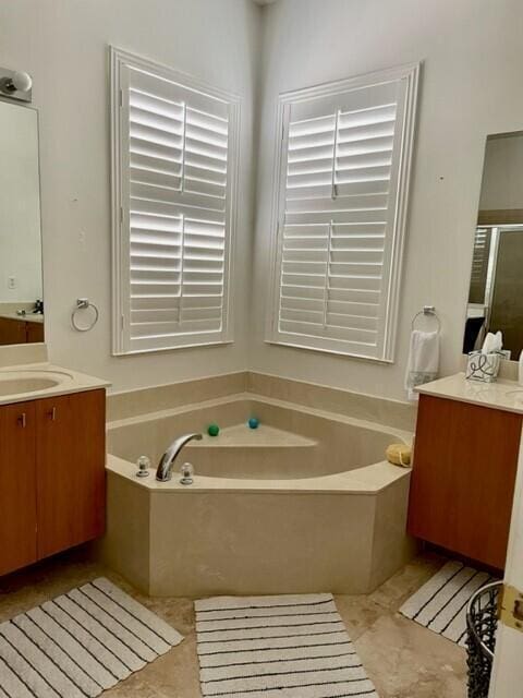 bathroom with vanity, separate shower and tub, and tile patterned flooring